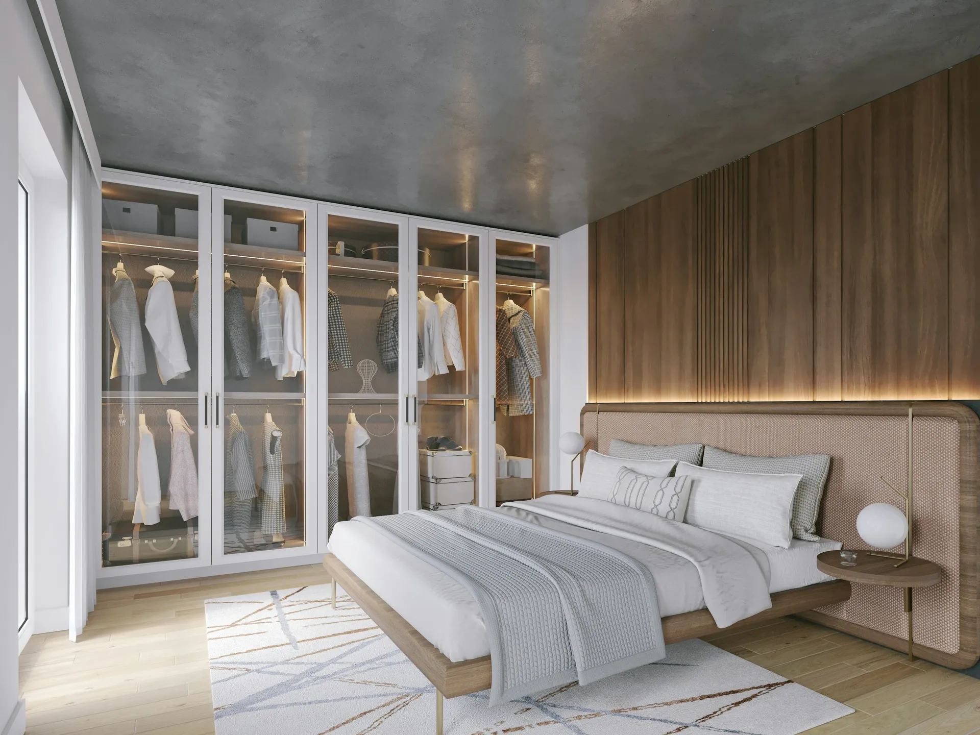 Bedroom with a full wall of glass-front wardrobes beside the bed