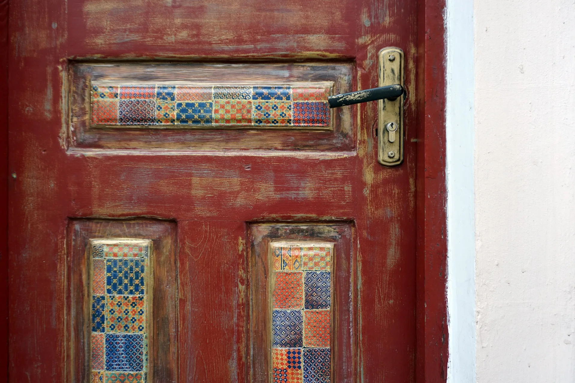 Laminate main door with a black steel gate at the entrance of a Singapore flat