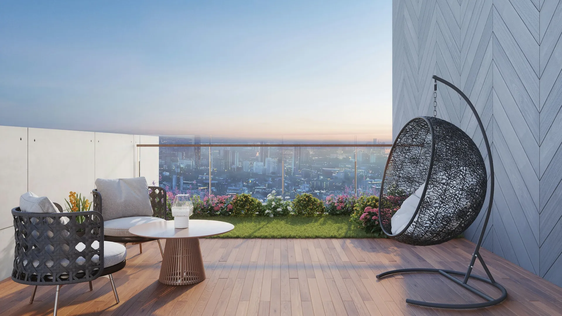 High-floor balcony with glass railing, lounge seating and a hanging egg chair
