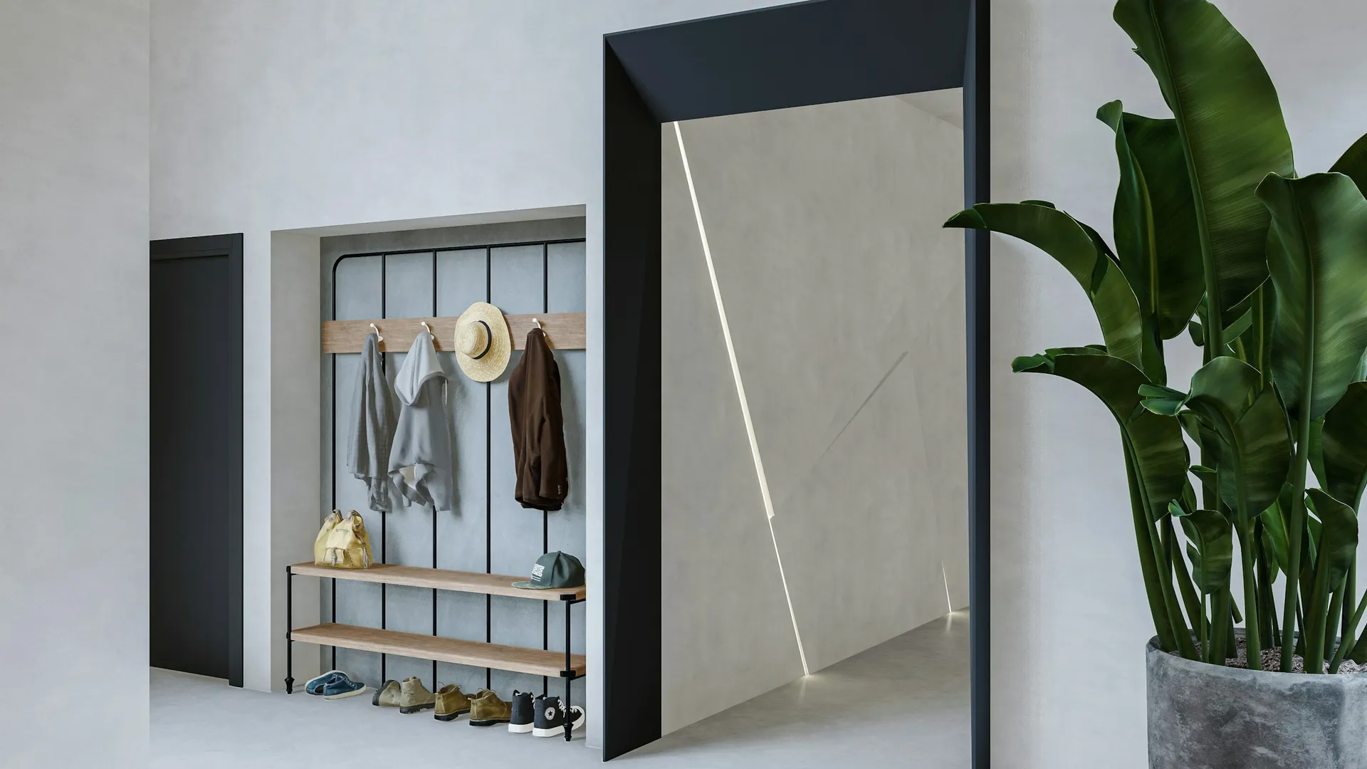 Recessed entry nook with coat hooks above a low shoe bench